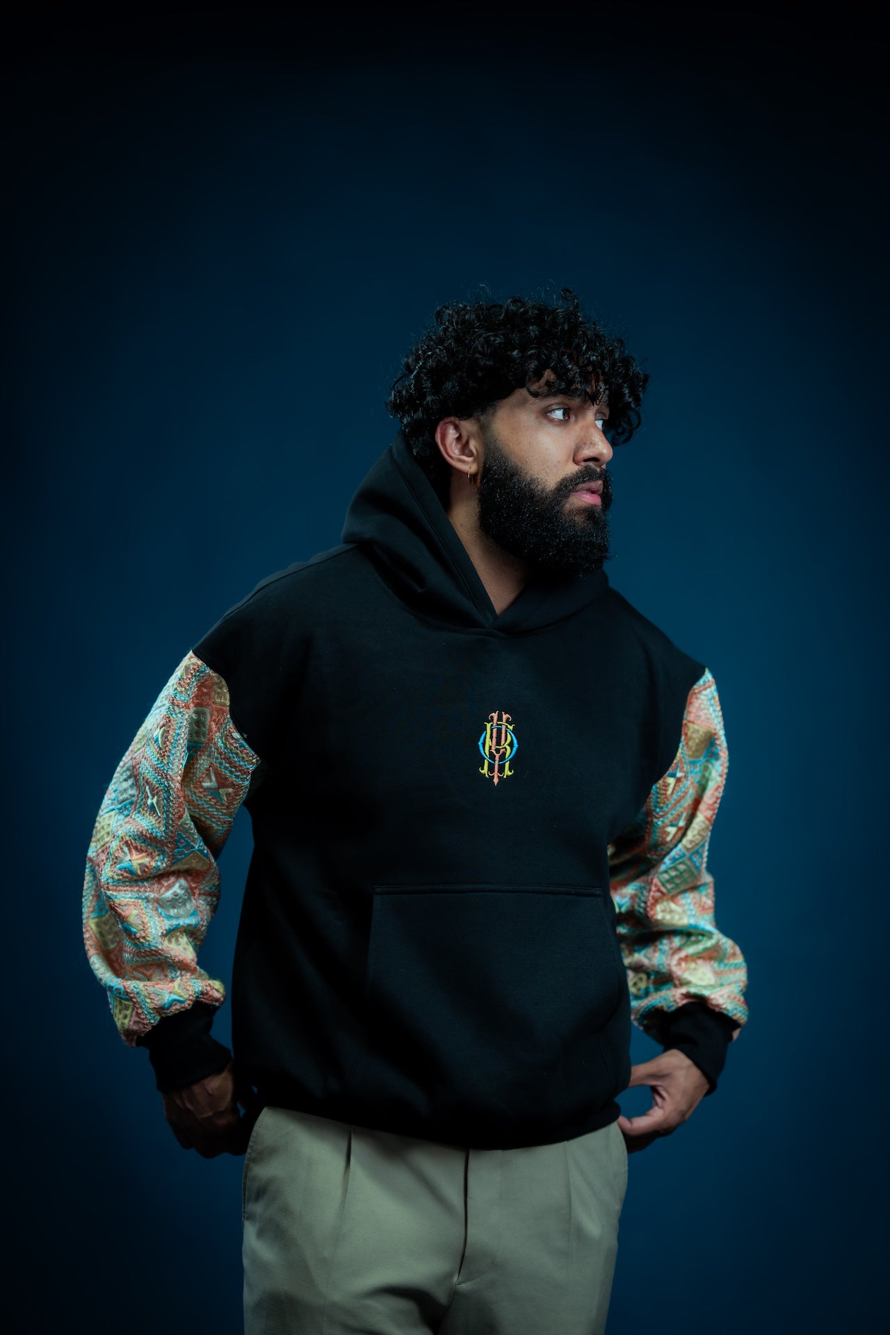 YOR Pastel Phulkari Hoodie in black featuring soft pastel colored phulkari on sleeves