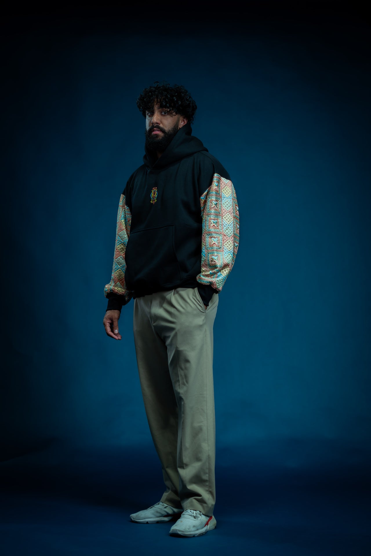 YOR Pastel Phulkari Hoodie in black featuring soft pastel colored phulkari on sleeves